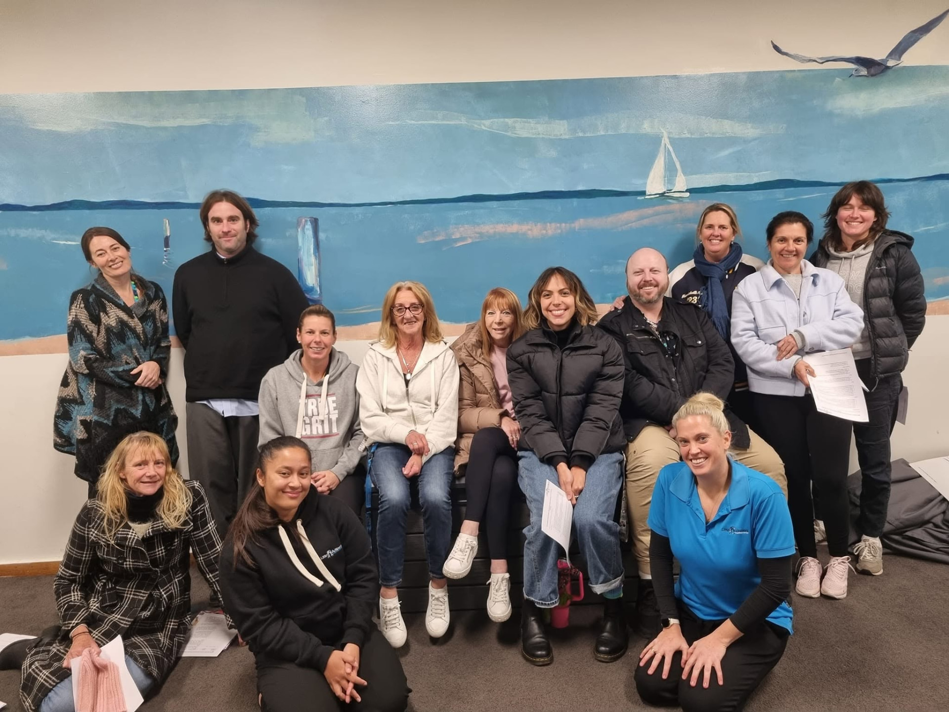 Little Achievers staff and local families together at a community event